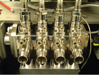 Liquid filling machine pump valve block
