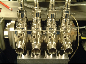Liquid filling machine pump valve block